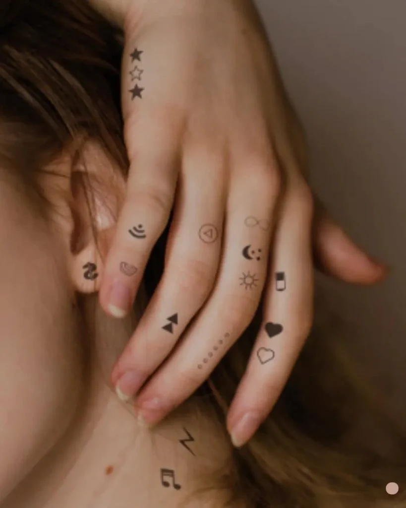 Tiny tattoo ideas for women subtle fine line clover leaf tattoo on finger.