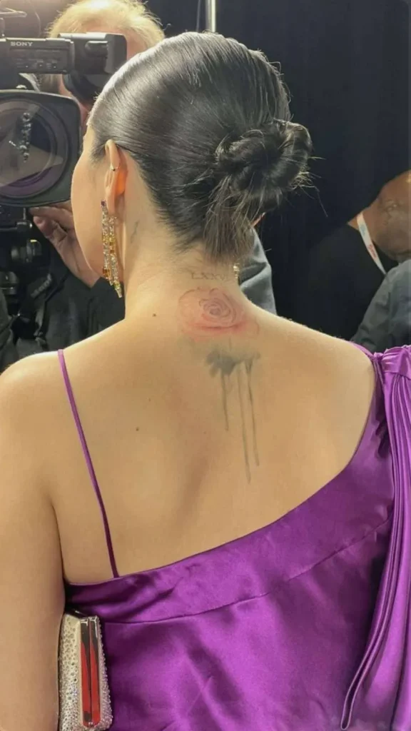 Selena Gomez’s Back Tattoo Rosebud.